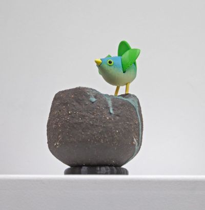stoneware bird nest I, with green bird by Chris Barnes