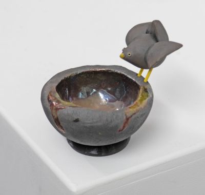 raku bird's nest, with black bird by Chris Barnes