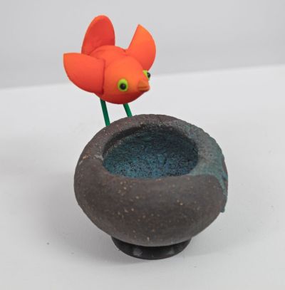 orange bird on black nest II by Chris Barnes
