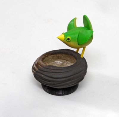 stoneware bird nest II, with green bird by Chris Barnes